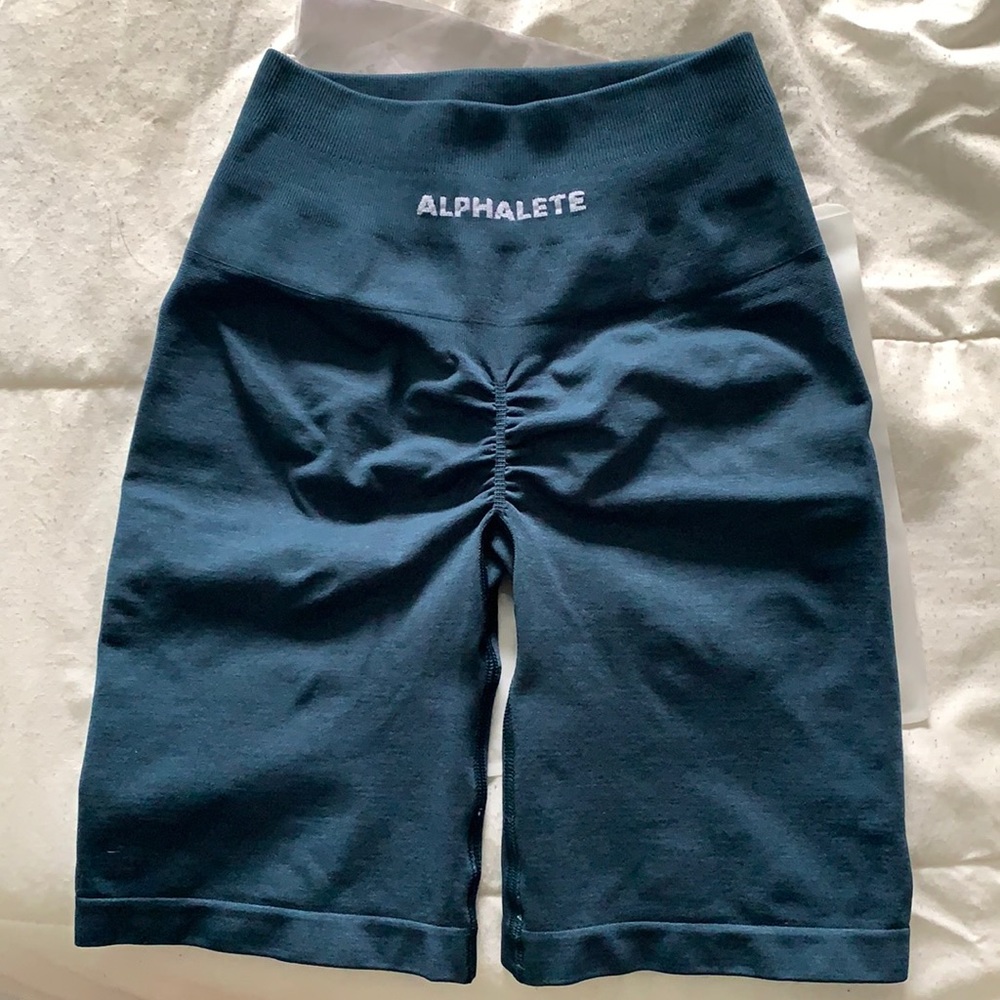Alphalete amplify biker shorts in deep water